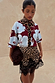 Thumbnail for Burgundy & Blue Poppy Cardigan with leopard print trim, styled with a leopard lace skirt and brown neck scarf.