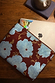 Blue & Burgundy Poppy Laptop Case with a bold floral print and zip closure, designed in-house for your tech essentials.