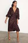Chocolate Sequin Vienna Dress featuring a multi-wear wrap waist and puffed sleeves in a midi length.