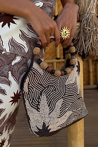 Soleil Beaded Bag in chocolate and cream with a hand-embellished sun print and circular raffia and wooden handles.