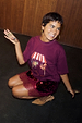 Burgundy Fruit Shop T-Shirt with an in-house designed fruit stall print, styled with a sequin and lace skirt.