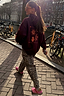 Thumbnail for Burgundy Hoodie with Coral Embroidery featuring sun and snake motifs, styled with leopard print trousers.