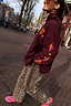 Thumbnail for Burgundy Hoodie with Coral Embroidery, styled with leopard print trousers and pink trainers on a city street.