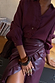 Thumbnail for Burgundy Vegan Leather Ruffle Jaspre Skirt and matching ruffle shirt with chunky statement accessories.