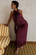 Burgundy Maeva Midi Skirt in satin with a lace trim hem, styled with a matching bow halter top and silver sandals.