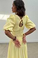 Thumbnail for Butter Yellow Nara Dress featuring a shirred back, keyhole tie detail and puffed sleeves.