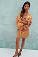 Tan Suede Mini Jaspre wrap skirt paired with an embroidered camel cardigan and leopard print heels.