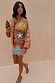 Camel Mystical Cardigan with sun and moon embroidery and red contrast trim.