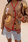 Camel Mystical Cardigan with sun, moon and star embroidery and red trim, styled with a leopard print clutch.