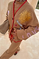 Camel Mystical Cardigan with sun and moon embroidery, red contrast trim and matching knitted trousers.
