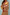 Thumbnail for Camel Mystical Cardigan with sun embroidery, red trim and button-up front, styled with a tan skirt.