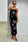 Thumbnail for Black Seashell Mesh Cami Dress featuring a white starfish and shell print, styled on a model against a white wall.