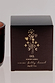 NFD Eau De Parfum Candle 001 packaging in dark brown featuring gold foil palm tree and celestial illustrations.