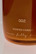NFD Eau De Parfum Candle 002 in an amber glass jar with gold lettering and the signature cursive logo.