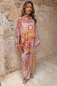 Dolce Vita Cape Top in a pastel patchwork tile print with an asymmetric hem, fluid sleeves and matching scarf.