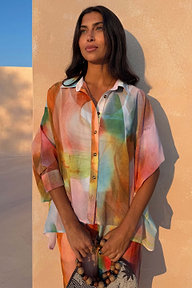 Multicoloured Abstract Cape Shirt with a relaxed, oversized silhouette and button-up fastening on a model.