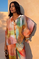 Multicoloured Abstract Cape Shirt with a relaxed oversized fit, button-up front, and wide cape sleeves.