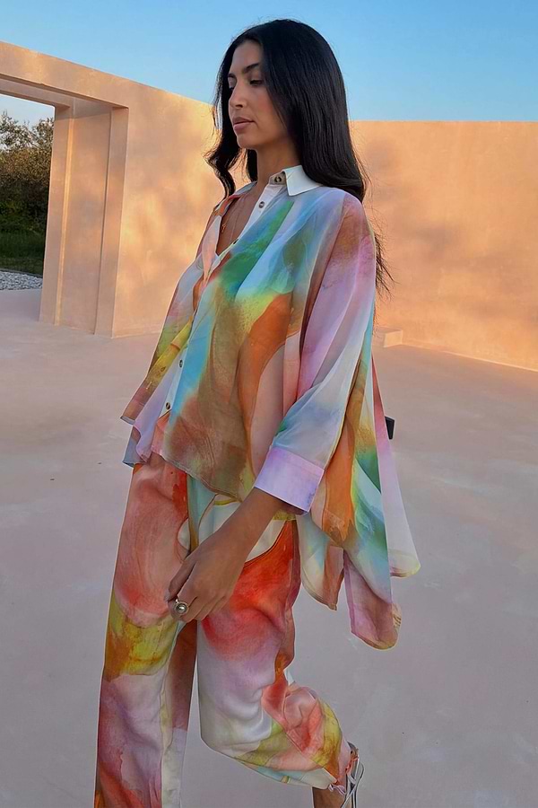 Multicoloured Abstract Cape Shirt featuring an oversized silhouette and button-up front, paired with matching trousers.