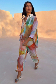Multicoloured Abstract Cape Shirt in a relaxed oversized fit, styled with matching co-ord trousers for a vacation.