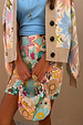 Dreamer Astrid Cardigan with colourful sun and palm motifs, featuring a ribbed border and button-up fastening.