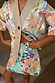 Dreamer Astrid Cardigan featuring pastel sun and star motifs in a soft knit, paired with a matching beaded skirt.