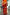 Thumbnail for Red Celestial Dorris satin maxi skirt featuring hand-painted sun and hand motifs on a red base.