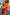 Thumbnail for Red satin Celestial Dorris Skirt with hand-painted motifs, styled with an orange tank top and a statement belt.
