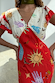 Red Celestial Midi Dress featuring a V-neckline and flutter sleeves with iconic celestial sun and hand motifs on viscose.