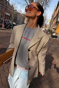 Tailored grey Check Blazer layered over a sweatshirt for a transeasonal street style London look.