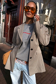 Tailored Grey Check Blazer layered with a slogan sweatshirt and lace-trim denim for a London street style look.