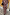 Thumbnail for Chocolate brown Check Floral Lottie Skirt and matching top co-ord with vibrant floral motifs.