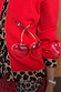 Red Cherry Holly Cardigan detail highlighting the embroidered cherry motifs and leopard print knit trim.