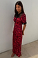 Thumbnail for Red Cherry Lyla Dress with an all-over cherry print, black lace at the neckline and cuffs, and a neck tie.
