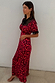 Thumbnail for Red Cherry Lyla Dress with a cherry print, black lace detailing on the neck and cuffs, and a tie neckline.