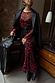 Thumbnail for Red Cherry Mesh Soho Dress in a digital cherry print, styled with a black blazer, belt and a statement fringe bag.