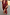 Thumbnail for Black Cherry Sarong with a deep red cherry print and tie-waist fastening, styled on a sandy beach.