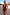 Thumbnail for Black Cherry Plunge Suit featuring an all-over red cherry print and plunging neckline, worn on a sandy beach.