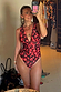 Black Cherry Plunge Suit featuring a deep V-neckline and all-over red cherry print for feel-good dressing.