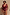 Thumbnail for Black Cherry Plunge Suit with an all-over red cherry print, plunging neckline and gathered waist on a model.