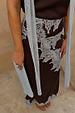 Chocolate Lily Skirt in brown satin featuring light blue lace detailing and a matching clutch.
