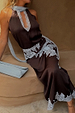 Chocolate Lily Skirt in brown satin with blue lace trim, styled with a matching top and a blue clutch bag.