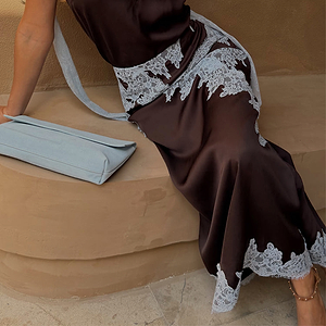Chocolate Lily Skirt in brown satin with light blue lace trim, styled with a matching top and light blue clutch.