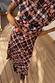 Chocolate brown Check Floral Lottie midi skirt and matching co-ord top with pink floral motifs on a wooden deck.