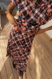 Chocolate brown Check Floral Lottie midi skirt and matching co-ord top with pink floral motifs on a wooden deck.