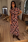 Check Floral Lottie midi skirt co-ord in chocolate brown check with floral motifs, styled with boots and sunglasses.