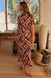 Chocolate brown Check Floral Lottie Skirt and matching top with vibrant floral motifs in a lifestyle setting.