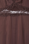 Chocolate Mimi Dress detail highlighting the intricate brown lace trim and under-bust cutout design.