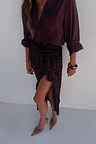 Iconic Chocolate Sequin Jaspre wrap skirt paired with a dark brown shirt and tan pointed-toe heels.