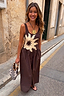 Thumbnail for Chocolate Sun Poplin Jumpsuit with a sun motif bodice and wide leg trousers on a model in a sunny street.