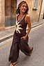 Thumbnail for Chocolate Sun Poplin Jumpsuit with a soleil print bodice and wide-leg cotton trousers, styled on a city street.